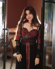 Mysterious Actress Divya Bharathi in a Red Embroidered Bustier with Black Sheer Overlay Skirt Photos 07