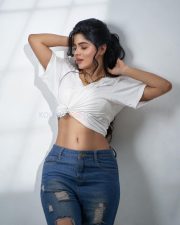 Sexy Divyabharathi Navel in a White Knot Front Crop Top and Blue Denim Photos 02