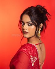 The RajaSaab Actress Riddhi Kumar in a Crimson Red Saree with a Red Sleeveless Blouse with a U Shaped Neckline Pictures 01