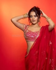 The RajaSaab Actress Riddhi Kumar in a Crimson Red Saree with a Red Sleeveless Blouse with a U Shaped Neckline Pictures 03