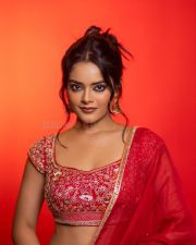 The RajaSaab Actress Riddhi Kumar in a Crimson Red Saree with a Red Sleeveless Blouse with a U Shaped Neckline Pictures 05