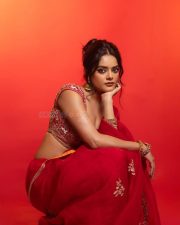 The RajaSaab Actress Riddhi Kumar in a Crimson Red Saree with a Red Sleeveless Blouse with a U Shaped Neckline Pictures 06