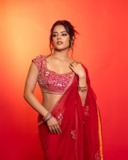 The RajaSaab Actress Riddhi Kumar in a Crimson Red Saree with a Red Sleeveless Blouse with a U Shaped Neckline Pictures 09