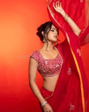 The RajaSaab Actress Riddhi Kumar in a Crimson Red Saree with a Red Sleeveless Blouse with a U Shaped Neckline Pictures 10