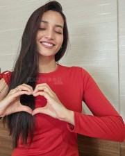 Actress Srinidhi Shetty in a Full Sleeve Red Crop Top Photos 01