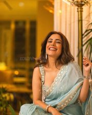 Beautiful Nisha Aggarwal in a Sky Blue Pleated Saree with a Sleeveless Embroidered Blouse Photos 04