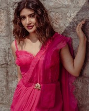 Alluring Sreeleela in a Pink Flared Saree with a Single Strap Blouse and Golden Belt Photos 03