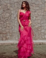 Alluring Sreeleela in a Pink Flared Saree with a Single Strap Blouse and Golden Belt Photos 04