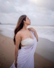 Bold Neha Malik in a White Saree at the Beach Photos 01