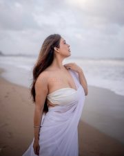 Bold Neha Malik in a White Saree at the Beach Photos 01