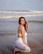 Bold Neha Malik in a White Saree at the Beach Photos 02