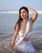 Bold Neha Malik in a White Saree at the Beach Pictures 02