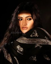 Bold Sreeleela in a Black Saree with Metallic Gold Motifs and Sleeveless Deep Cut Blouse Photos 04