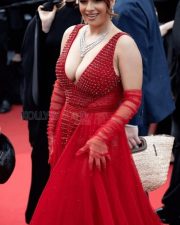 Bold and Busty Neha Malik in a Red Crystal Embellished Scarlet Gown with a Cleavage Revealing Neckline Photos 03