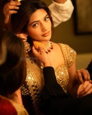 Breathtaking Sreeleela in a Golden Beige Mirror Work Saree with Matching Blouse Photos 01