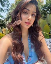 Charming Actress Eshanya Maheshwari in a Blue Floral Halter Dress Photos 02