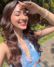 Charming Actress Eshanya Maheshwari in a Blue Floral Halter Dress Photos 03