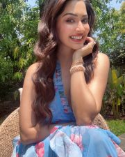 Charming Actress Eshanya Maheshwari in a Blue Floral Halter Dress Photos 04