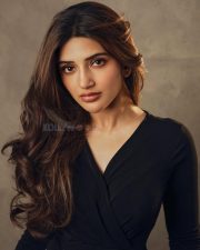 Classy Sreeleela in a Black Full Sleeve Top and Blue Denim Jeans Photos 01