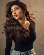 Classy Sreeleela in a Black Full Sleeve Top and Blue Denim Jeans Photos 02