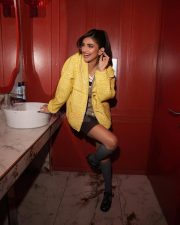 Dazzling Sreeleela in a Yellow Tweed Jacket with a Black and White Striped Knit Tank Top and Brown Mini Shorts Pictures 01