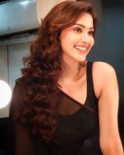 Enchanting Actress Eshanya Maheshwari in a Black Sheer Saree Photos 07
