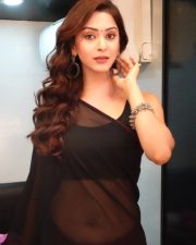 Enchanting Actress Eshanya Maheshwari in a Black Sheer Saree Photos 08