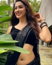 Eshanya Maheshwari Hot Navel in Black Saree Photos 04