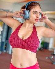 Hot Neha Malik in a Maroon Gym Sports Bra and Matching Leggings Photos 03