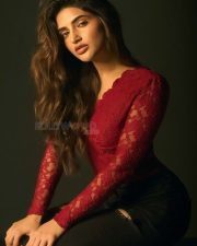 Kissik Girl Sreeleela in a Sleek Red Maroon Lace Full Sleeve Top and Ripped Black Jeans Photos 02