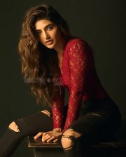 Kissik Girl Sreeleela in a Sleek Red Maroon Lace Full Sleeve Top and Ripped Black Jeans Photos 04