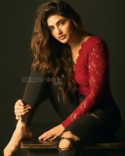 Kissik Girl Sreeleela in a Sleek Red Maroon Lace Full Sleeve Top and Ripped Black Jeans Photos 05