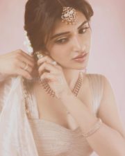 Parasakthi Heroine Sreeleela in a Beige Lehenga with a Spaghetti Strap Crop Top and Flared Skirt Photos 03