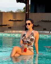 Picturesque Actress Eshanya Maheshwari in a Tropical Print Swimsuit Photos 04