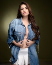 Provocative Neha Malik in an Oversized Denim Shirt with a White Pleated Tennis Mini Skirt Photos 07