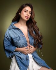 Provocative Neha Malik in an Oversized Denim Shirt with a White Pleated Tennis Mini Skirt Photos 08