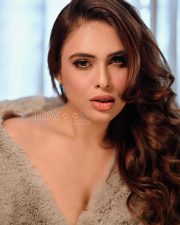 Seductive Neha Malik Cleavage in a Grey Faux Fur Coat Photos 01