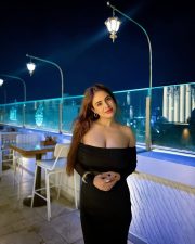 Sexy Neha Malik in a Black Off Shoulder Bodycon Maxi Dress Photos 01