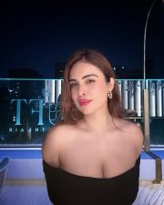 Sexy Neha Malik in a Black Off Shoulder Bodycon Maxi Dress Photos 02
