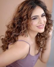 Sexy Neha Malik in a Stylish Purple Corset Top and Mini Skirt Photos 07