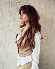 Sexy Sreeleela in a Beige Vest over a White Shirt and Beige Pants Photos 03