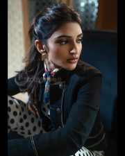 Sexy Telugu Heroine Sreeleela in a Black and White Polka Dotted Crop Top and High Waisted Trousers with a Black Jacket Photos 02