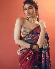 Spellbinding Actress Sreeleela in a Dark Blue Floral Print Saree With Embellished Blouse Photos 01