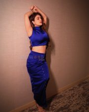 Sultry Actress Neha Malik in a dark navy blue high neck crop top with matching button up mini skirt photos 10