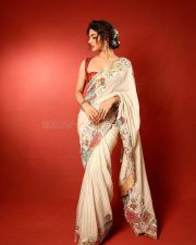 Talented Heroine Sreeleela in an Off White Floral Saree with a Deep Red Low Cut Blouse Photos 04