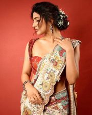 Talented Heroine Sreeleela in an Off White Floral Saree with a Deep Red Low Cut Blouse Photos 05
