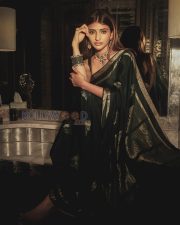 Timeless Actress Sreeleela in a Dark Green Silk Saree Photos 01
