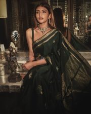 Timeless Actress Sreeleela in a Dark Green Silk Saree Photos 03