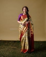 Ustaad Bhagat Singh Heroine Sreeleela in a Gold and Red Silk Saree with a Contrasting Purple Blouse Photos 01