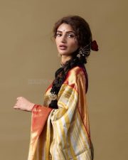 Ustaad Bhagat Singh Heroine Sreeleela in a Gold and Red Silk Saree with a Contrasting Purple Blouse Photos 04